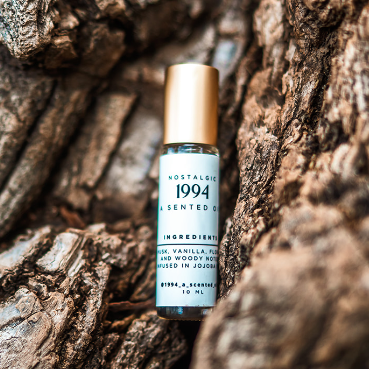 Vial labeled 'Skechers' on a textured stone surface